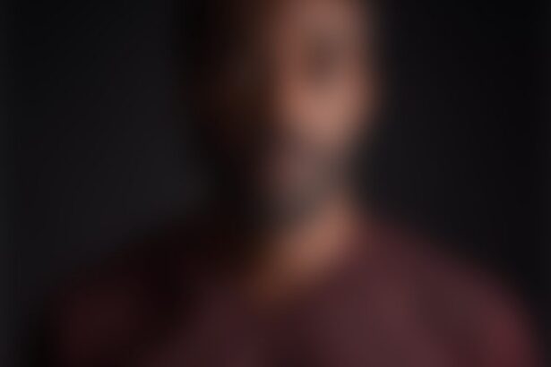 Blurred portrait of person against dark background