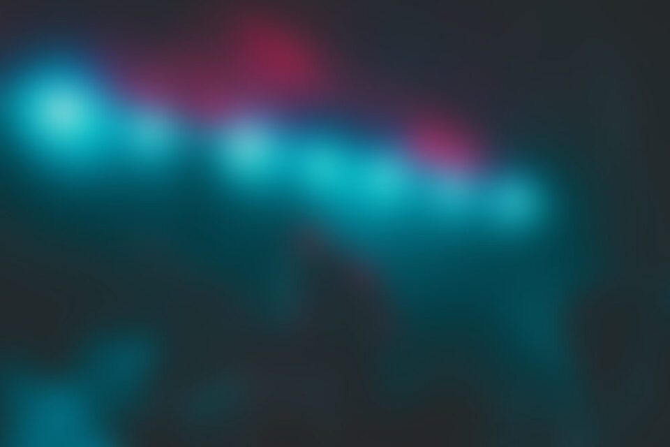 Blurry teal and red neon lights